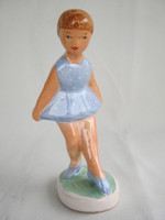 Little girl in ceramic blue dress