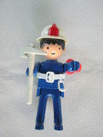 Retro plastic toy figurine firefighter