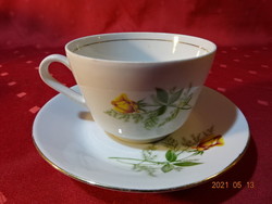 Kahla German porcelain, yellow rose patterned teacup + placemat. He has!