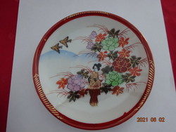 Japanese porcelain teacup coaster, diameter 14 cm. He has!