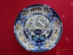 Moroccan porcelain, coffee cup doily, peacock pattern. He has!