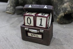 Brown suitcase perpetual calendar