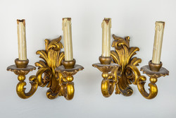 Pair of richly carved and gilded candlesticks