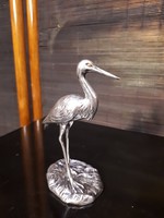 Ezüst gólya szobor