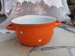 Beautiful yellow orange polka dot enamel bowl in a peasant bowl, like a peasant pot