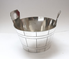 Showy, silver-plated, pot-shaped holder.