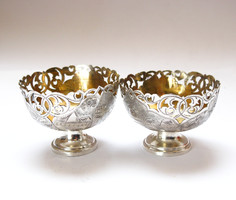 Ornate Turkish silver coffee cup holders.