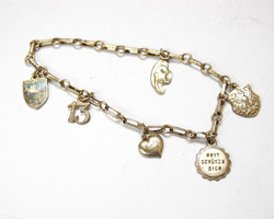 Silver bracelet with 6 charms.
