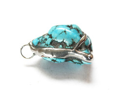 Handcrafted turquoise stone pendant.