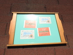 Very retro pine wood tray decorated with beer labels behind glass