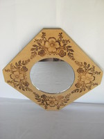 Retro wall mirror with wooden frame decorated with flowers
