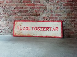 Hand painted fire station labeled sign in loft