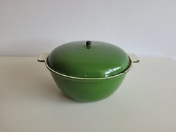 Old vintage green enamel cast iron baking dish with pot lid on iron dish