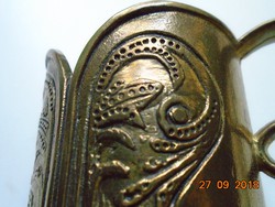 Art Nouveau floral motif with curved shapes, bronze cup holder