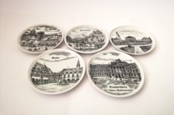 10 black mini plates and coasters with images of different cities