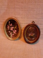Old beautiful oval small picture frames with small paintings inside