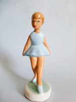 Retro little girl in ceramic skirt, ballerina