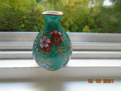 Small emerald green Chinese vase with hand painted colorful floral patterns