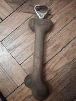 Wooden bone-shaped bottle opener from the 1980s