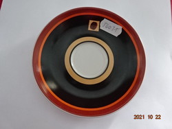 German porcelain coffee cup placemat, domestic steing, in black and brown. He has!