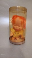 Vintage red-haired rubber doll in a hanging car mascot box