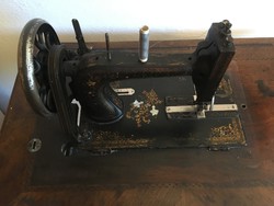 Antique sewing machine with Köhler brand foot drive with shell insert, floral pattern