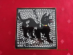 Dog patterned ceramic placemat, size 11 x 11 cm. He has!