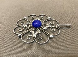 Silver pendant with blue pearls