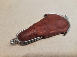 Antique sewing kit: silver thimble, steel scissors in leather bag