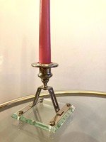 Art deco candle holder with polished glass base on metal legs