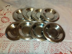 Glass saucers with metal saucers.