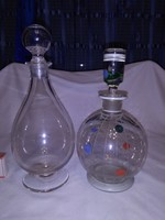 Two antique glass carafes, liqueur bottles together - one with foot, the other painted with dots