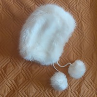 White pompom kid in faux fur hat
