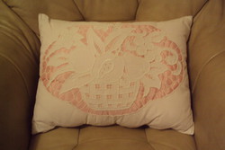 Vintage decorative pillow with patterned rice basket.