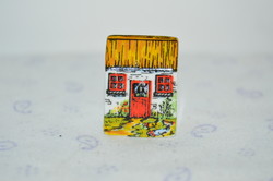From a collection of 1 cottage-shaped patterned Irish porcelain thimble
