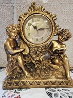 Eladó uj barokk mintás puttos Adler márkájú polirezin kandalló óra!