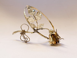 Old gilded silver rose ornament.