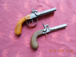 2 old pistols with flaps