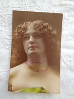 Portrait of antique hand-colored photo / postcard, lady with wavy hair 1910s