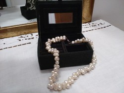 Black velvet jewelry box with white pattern and mirror