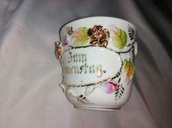 Antique commemorative cup from the early 1900s with a plastic flower ornament