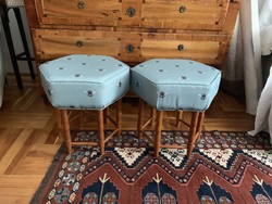 Two upholstered hard stuffed puffs / tables with fly covers
