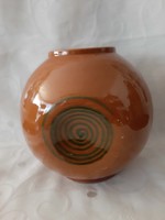 Retro spherical vase decorated with green spirals, mustard-colored, judged by an applied arts company