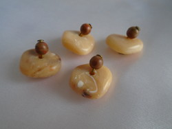 4 pcs. Antique amber art deco buttons with copper fittings.
