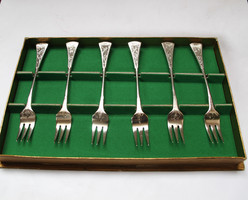 Ornate silver-plated dessert fork set.