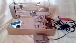 Mercury white sewing machine, maybe it belonged to Elvis' mom?