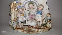 Rare German porcelain richly gilded castle-shaped clock with charming children's figures