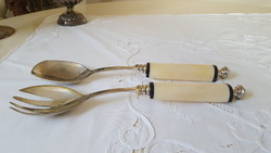 Antique, silver-plated servers with vinyl handles