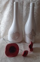 Wine bottles in white decor vases