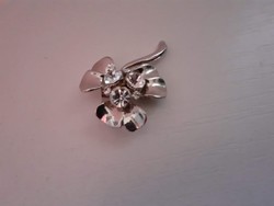 Old beautiful silver flower brooch decorated with polished white glass stones